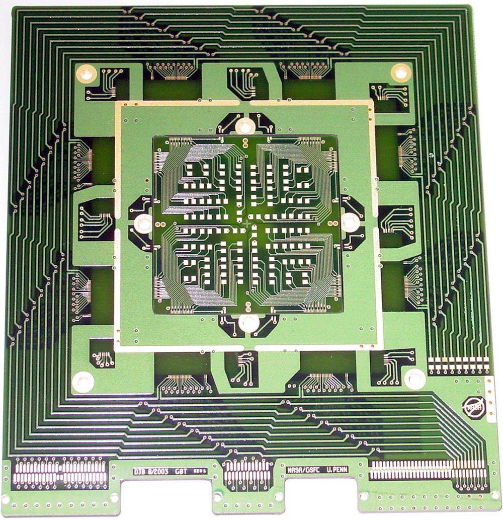The detector array is read out by a circuit board which surrounds the array chip itself.