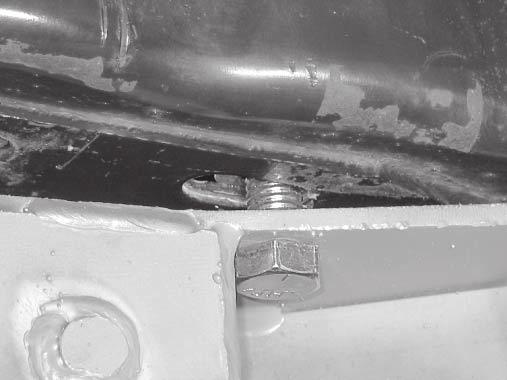 of the slot in the bottom wall of the frame rail. Front Mount Bracket 1/2" x 1-3/4" Cap Screw 8.