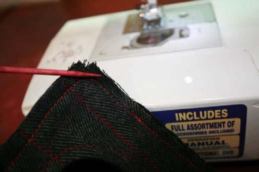Carefully sew around the top perimeter of the cover keeping the excess from under the needle as you move along.
