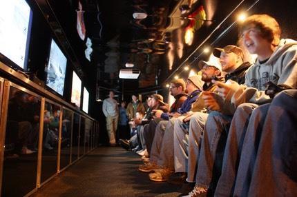 Rolling Video Games A game truck trailer with FOUR widescreen high-def TVs cover the walls in front of custom stadium seats with built-in vibration motors synched to the on-screen action with