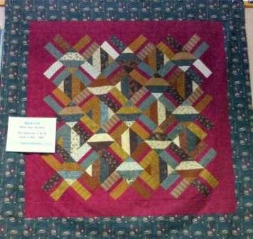 topper is another pattern by Jaybird Quilts that uses the side kick ruler! A unique way of putting triangles together without Y seams!