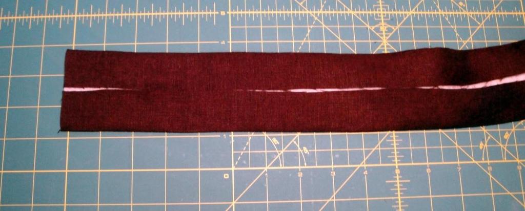 strap, lining up the edge with the drawn line. 11.