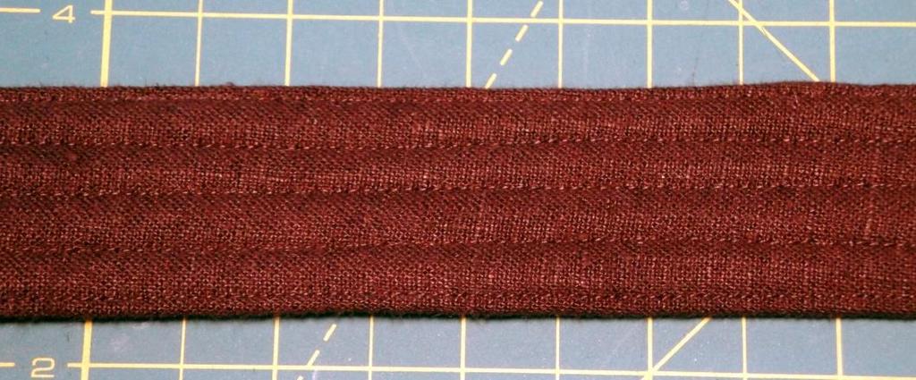 Fold the two halves together; then top stitch along both edges.