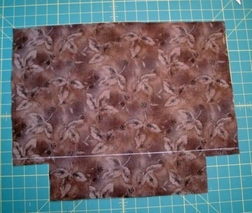 Iron the fusible fleece onto the wrong side of the lining fabric the fleece should be