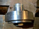 Before removing from the chuck, cut the groove to hold the shaft clamp (see below).