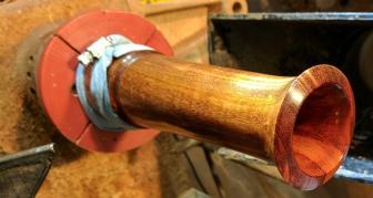 Using a piece of 50 grit sandpaper, the trumpet can be roughed in using the lathe to drive the sanding.
