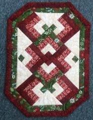 will be helping us to be ready to finish off our Christmas tree decorations with this beautiful pieced tree skirt.