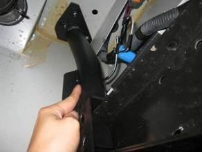 1.5 Temporarily remove the rear chassis cross member plastic cover to allow access to the upper mounting flange.
