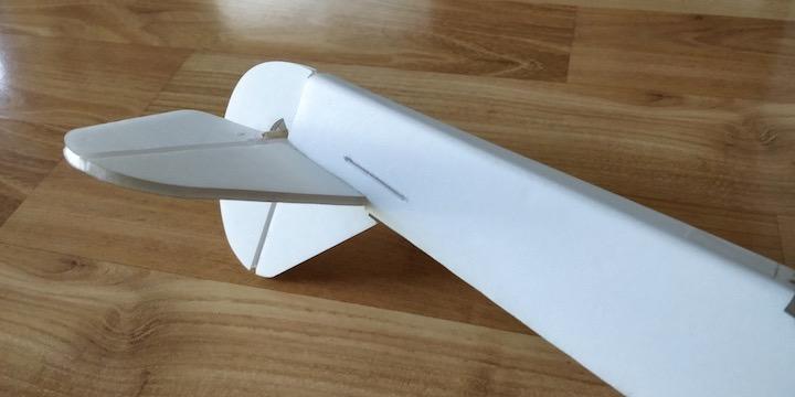 Apply glue once you are satisfied with the fit. Insert the vertical stabilizer by pressing its tab into the remaining slot on the horizontal stabilizer.