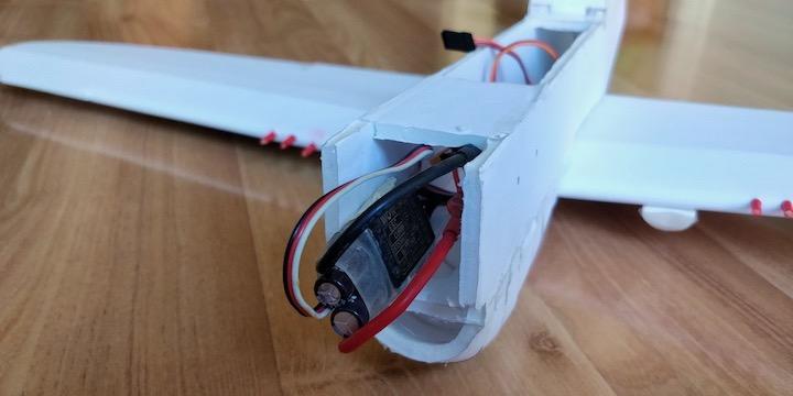 The ESC will pass vertically through the slot in the front fuselage and