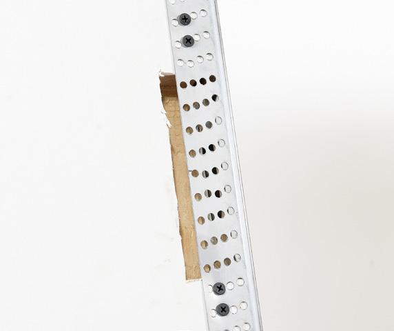 hinge notch through the perforated flange as shown opposite.