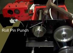 ) to drive the Roll Pin out of the Gear Pulley (Figure 6). Do not use a small or sharp pointed punch as it will expand the roll pin. Do not use excessive force.