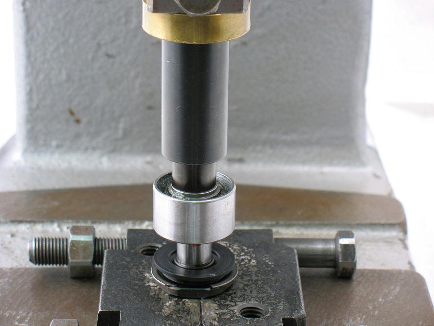 3. Use small diameter of 57091 Bearing Press Tool and arbor press to install 56052 Bearing.