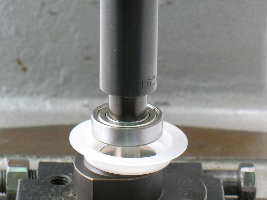 2. Use small diameter of 57091 Bearing Press Tool and