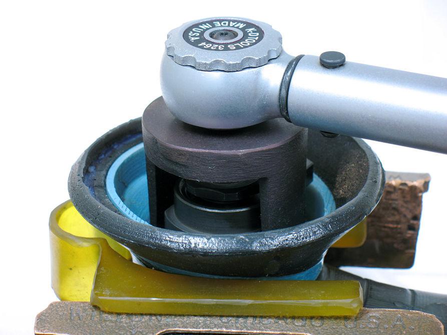 12. Place 57092 Repair Collar around housing. Fasten sander in vise with counterweight pointing up. Notice: Do not over tighten sander in vise or it will be difficult to install 59058 Lock Ring.