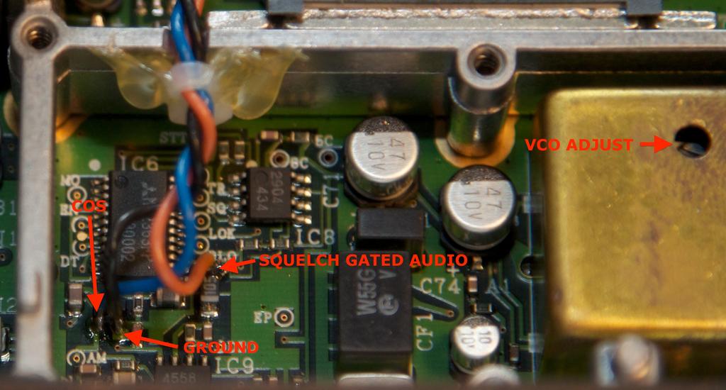 The following image shows the repeater controller interface wires attached to the receive radio. The COS wire is blue. The squelch gated de-emphasized audio is orange.