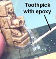 Once the fishing line is secure, mix up a small amount of 5 minute epoxy and spread it over the fishing line.
