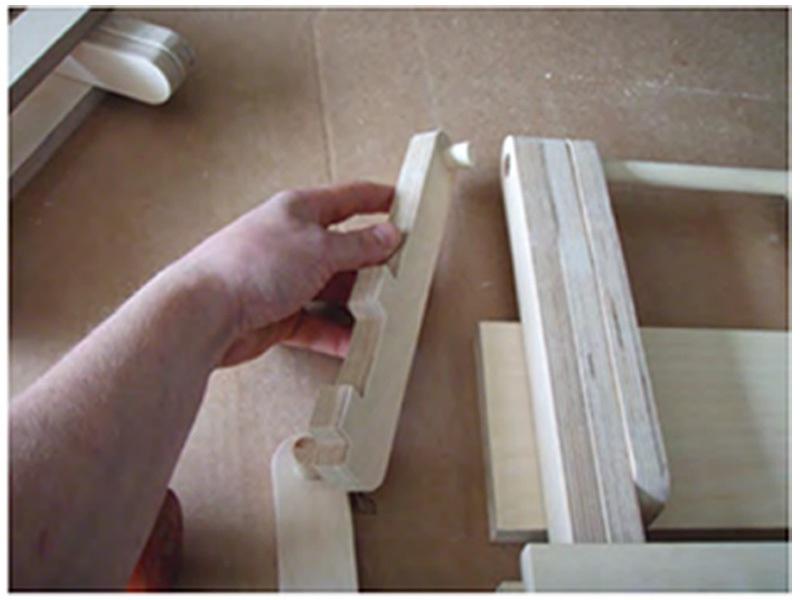Using the rubber mallet firmly press the two remaining dowels into the
