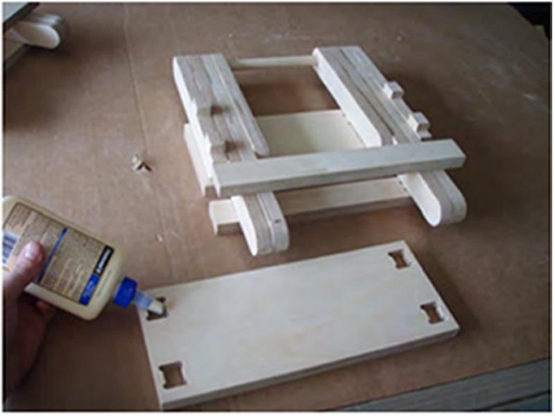 Install the remaining top supports onto the stool assembly.