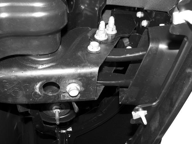 6. Select (1) tow hook. Insert the tow hook into the opening in the passenger side Frame Bracket.