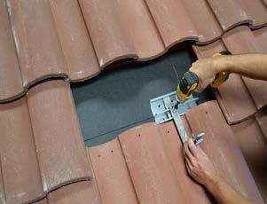 3) Apply roofing sealant to the bottom of the base and directly onto each lag screw.