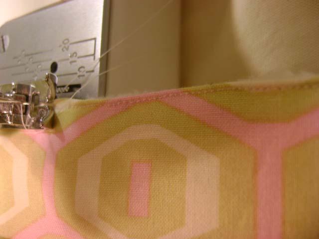 Stitch the lining to the bag. Now the magic happens turn the bag right-side out through the hole you left un- stitched.