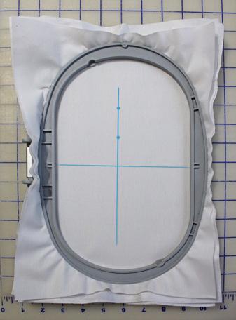 Hoop the fabric with Ultra Clean & Tear Stabilizer. Do not try to be perfectly straight in the hoop. 3. Touch the Selection (folder) icon.