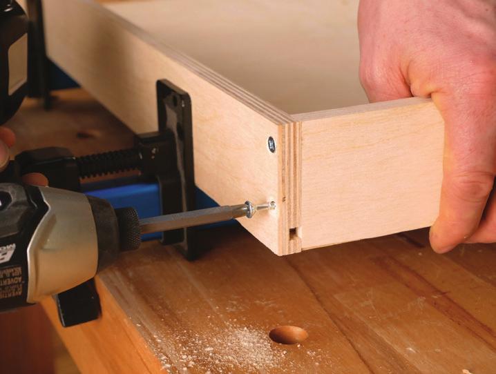 Align the bottom edge of the drawer slide ﬂush with the bottom edge and front edge of the cleat.