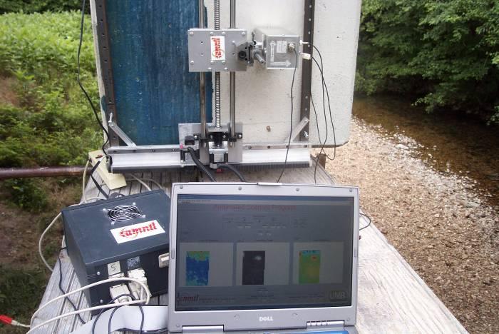 Figure 20 - A picture of the 2D scanning mechanism and the microwave reflectometer testing CFRP patch bonded