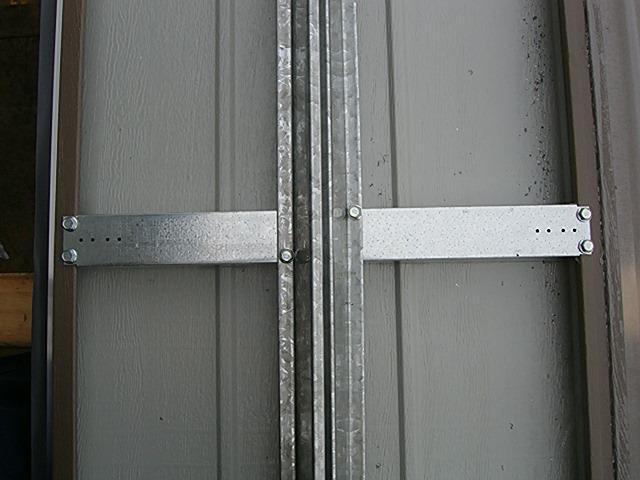 Figure 7 Typical Strut & Stile Fixing Trim weatherseal with a knife so about 10 15mm protrudes out each end. Centralise bottom panel in the door opening so that overlap is even on both sides.