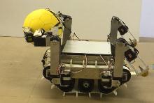 One object is placed on the floor and the robot grasps it from left and right sides using front two arms so that the center of palm touches to the surface of the object.