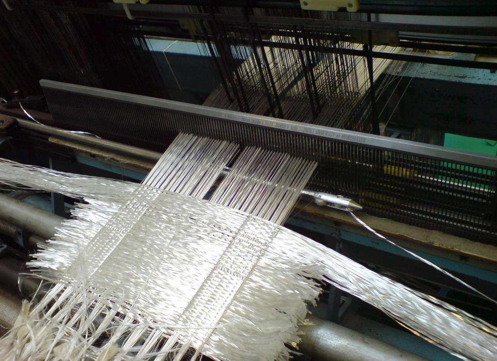 Fig: 3.16 Weft Insertion by Rapier in Jumberca Loom For the shuttle weaving machine, weft insertion is done by the shuttles. Because of the weft yarn stiffness, the weft insertion was done manually.