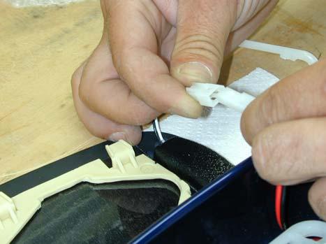 Guide the wire harness through the foam insulation and reposition the foam