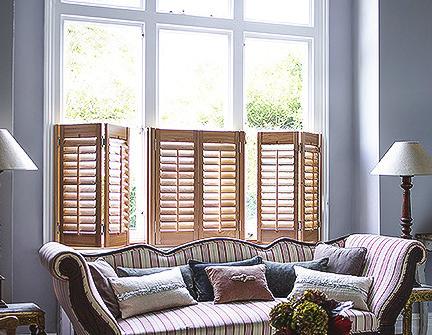 Café style plantation shutters have a frame that is drilled into the recess of the window opening. The panels will then fit inside the frame.