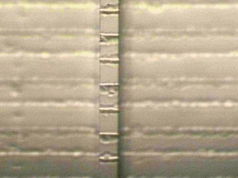 141 At the final stage of the sample preparation, the waveguides of width 4, 6, 9, 12 and 15 µm were defined in the material in a direction perpendicular to the grating. Figures 6.17 and 6.
