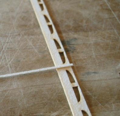 Cut pieces about the width of the window strip and glue them appropriately as shown in the instruction