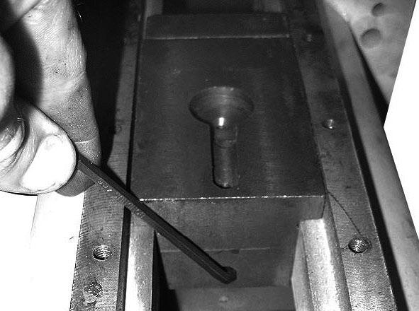7. Use a 4mm hex wrench to loosen slide block set screw (see Figure 7). 10.