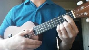 1. Use the tip of your index finger to push on the second fret of the C string. The second fret is between the first and second raised bar on the neck 2.