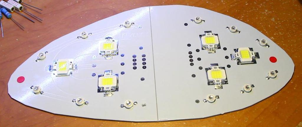 The polarity of the LEDs can be identified two ways: They have a tiny and stamped onto their feet, and the negative leg has a notch cut out of the