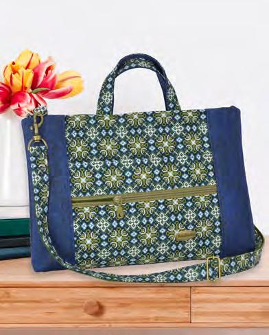 This purse has a zippered pocket and a double needle is used to achieve the quilted design on the front.