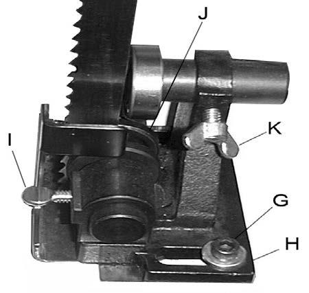 3. Loosen the socket head cap screws (G, Fig. 4) and position the blade guide assembly (H, Fig. 4) so that the guides rest just behind the gullet of the blade teeth.