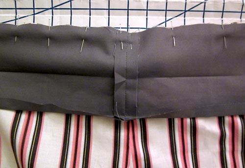 top of the shorts. Pin in place. 6. Using a ½" seam allowance, stitch the waistband in place. 7.