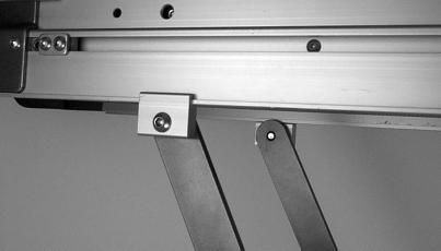 7d. Loosely attach brace bars (AC of Figure 15) to conveyor using clip assemblies.