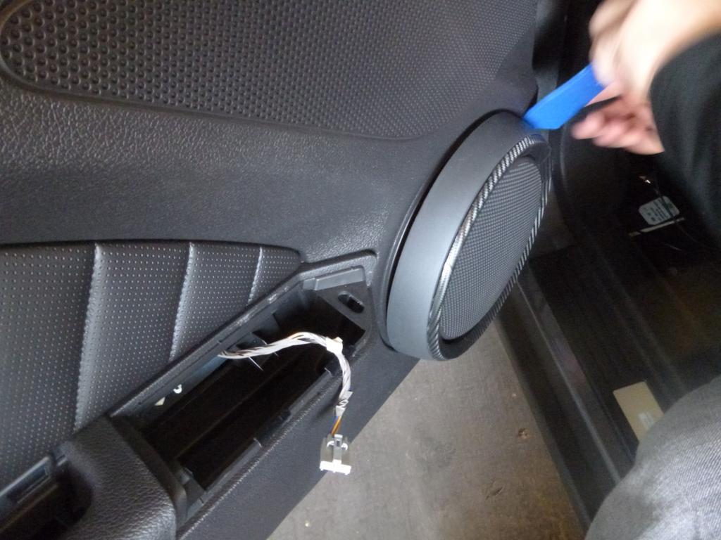 6) Using a pry tool along the outer edges, pop off the speaker cover Unscrewing the interior trim (10