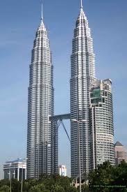 Stacking 100s of garden sheds does not get you the Petronas Twin Towers: The