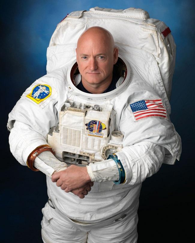 Captain Scott Kelly in the EMU (Extravehicular Mobility Unit) spacesuit that provides life support and communication during Earth orbit EVA (extravehicular activity).
