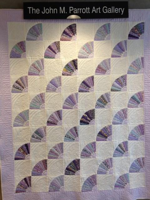 This beautiful quilt by Berlinde was on display at the Belleville Public Library in the summer. It features lace trim and beading on the fans.