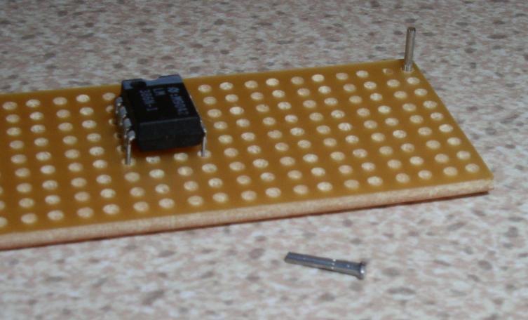 Diagonally opposite legs are first soldered. This makes sure the IC is held firmly. Next the veroboard track cutter is used to break 4 holes in the centre of the IC (or IC socket).