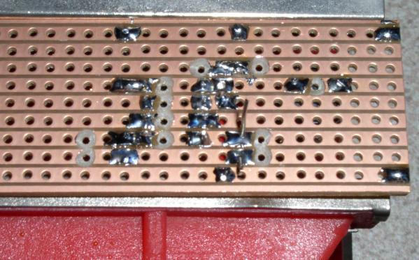is connected to the same track as the negative pin of the 10u capacitor. This is shown in the above picture. Step 14 The underside of the veroboard is shown below.