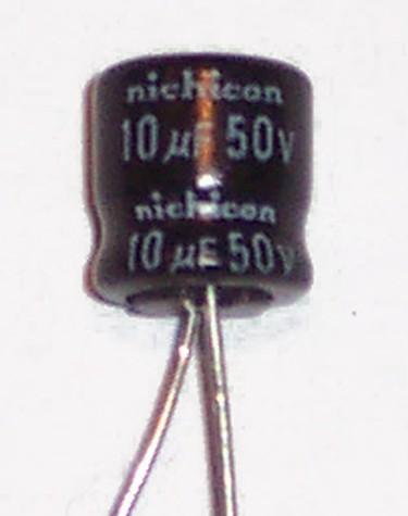 The Out is the pin that outputs the regulated 5 volts. The Capacitors: The capacitors you are using also have an orientation. It is very important that they get connected in the correct way.